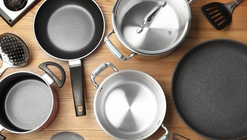 Flat lay composition with clean cookware on wooden background