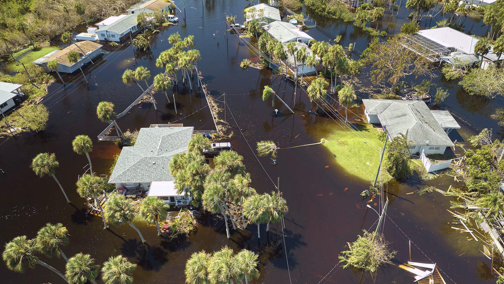 Hurricane Ian flooded houses in Florida residential area. Natural disaster and its consequences